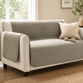 Homebody CozyGuard Blanket protecting a neutral living room sofa
